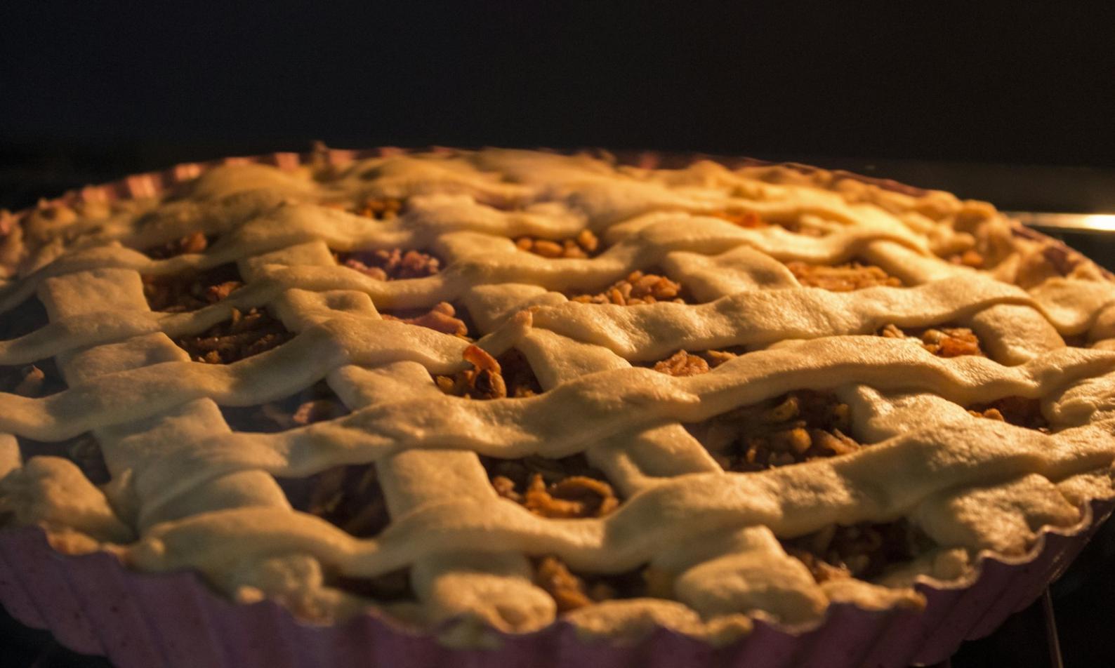 Professional catering team preparing event meals in commercial kitchen environment