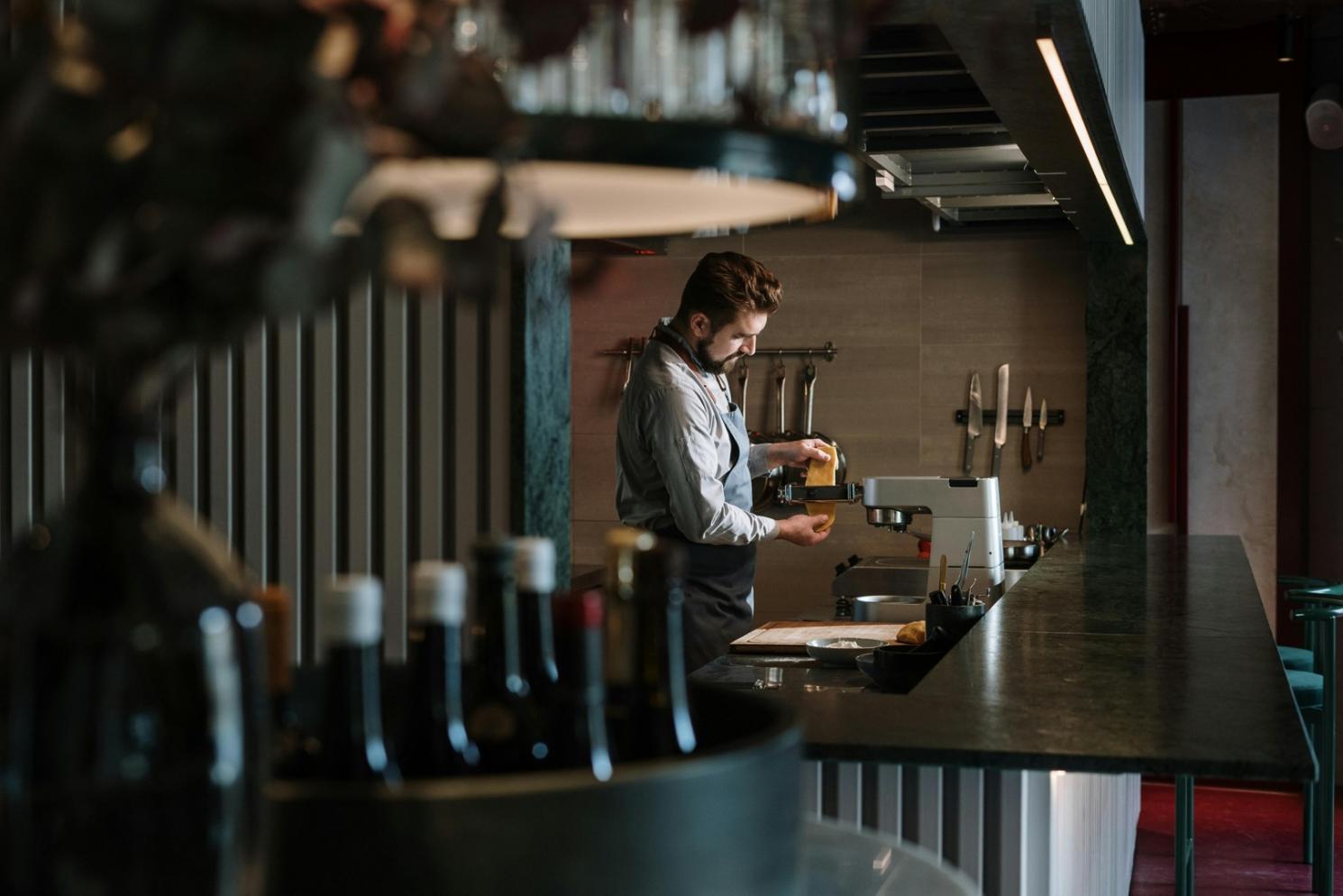 Professional event meal preparation showing organized food service stations with fresh ingredients and efficient workflow setup